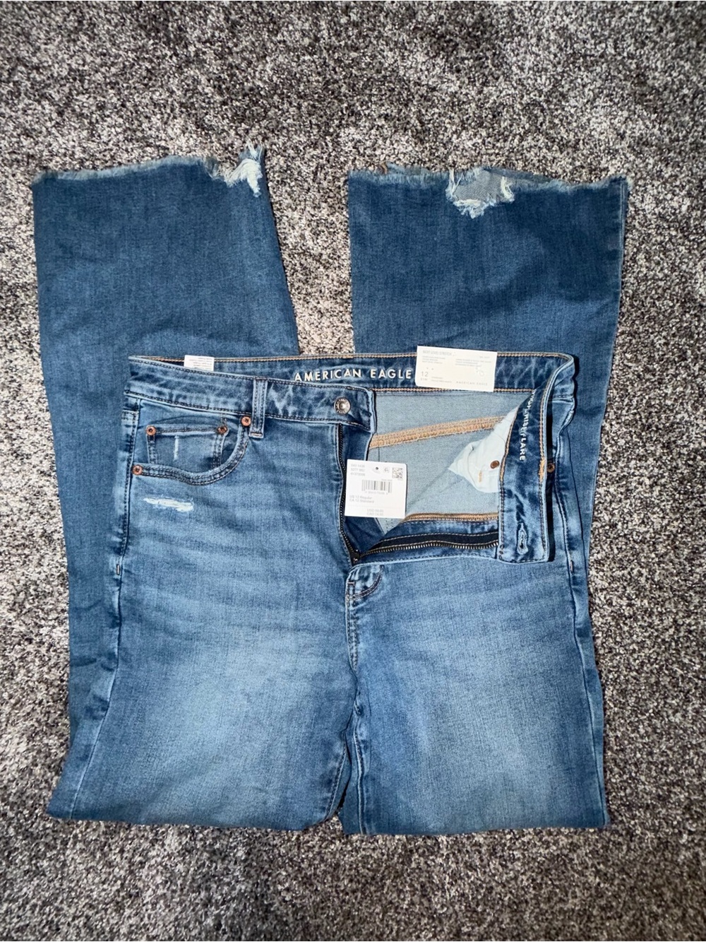American Eagle Outfitters Women's Medium Blue Flare Jeans with Distressed Hem